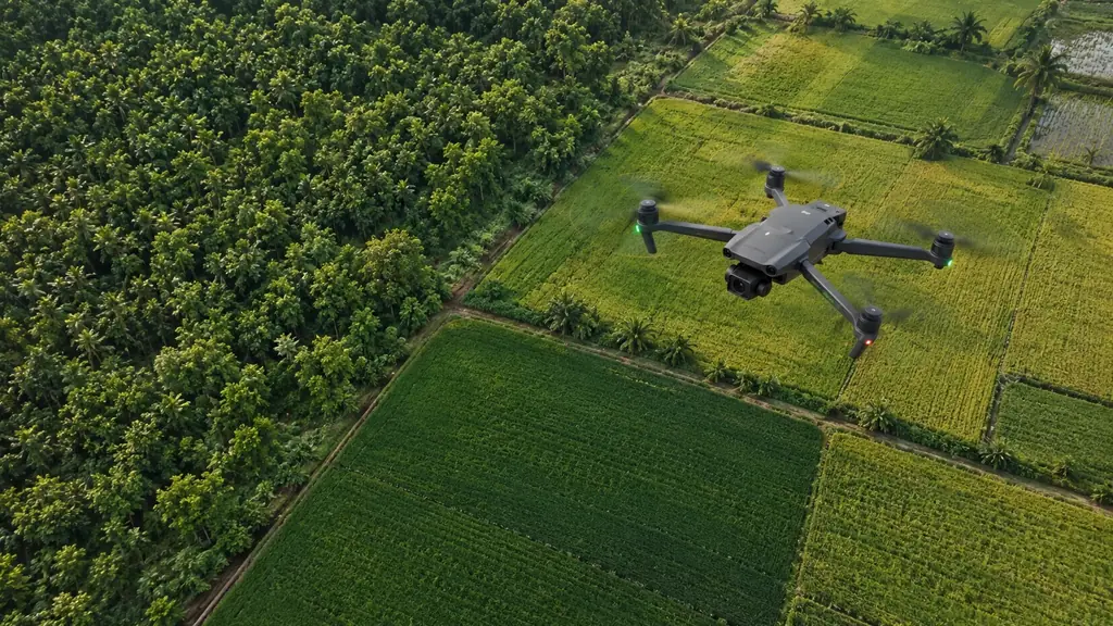 Survey drone in flight over cultivated fields