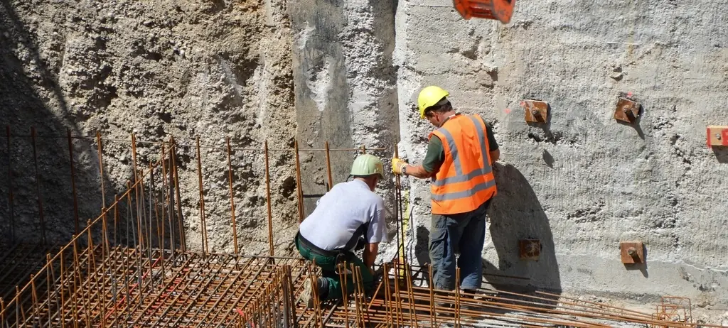 Engineers inspecting wall reinforcement