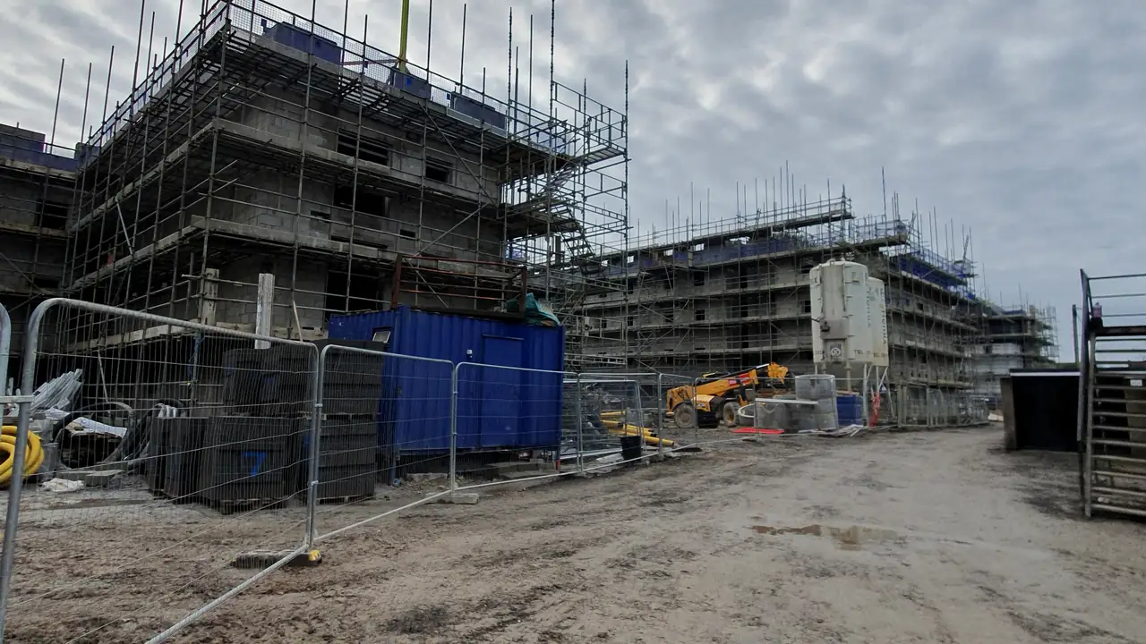 Scaffolded apartment buildings under construction